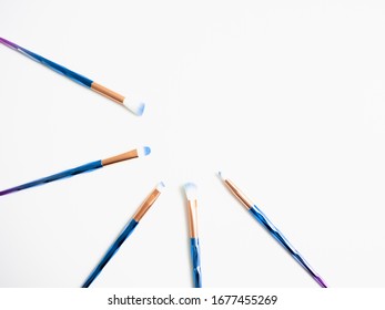 Classic Blue Eyeshadow Brushes Isolated On White Background With Space For Copy Space.