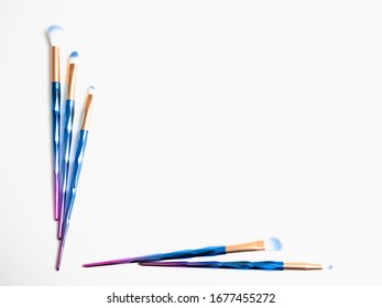 Classic Blue Eyeshadow Brushes Isolated On White Background With Space For Copy Space.