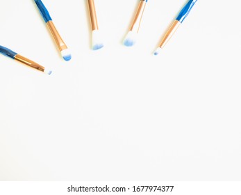 Classic Blue Eyeshadow Brushes Isolated On White Background With Space For Copy Space.