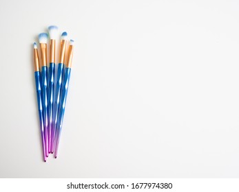 Classic Blue Eyeshadow Brushes Isolated On White Background With Space For Copy Space.