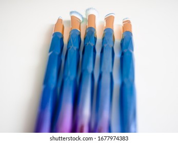 Classic Blue Eyeshadow Brushes Isolated On White Background With Space For Copy Space.