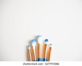 Classic Blue Eyeshadow Brushes Isolated On White Background With Space For Copy Space.