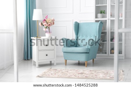 Classic blue and white theme living room - light blue armchair in white room