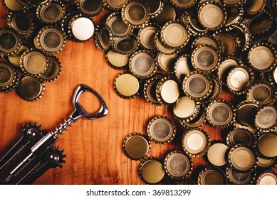 Classic Bottle Opener And Pile Of Beer Caps