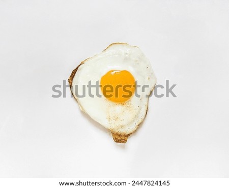 A classic breakfast of a fried egg on a white background