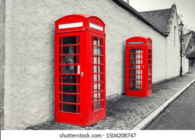 Classic British Old  red phone booth, monochrome image, UK