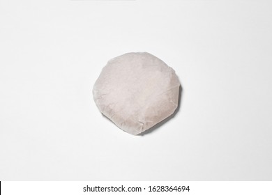 Classic Burger packed in the wrapping paper on white background. Top view. Hamburger Mock up.High resolution photo.