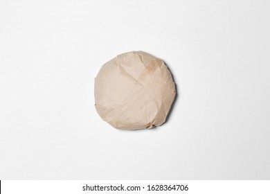 Classic Burger packed in the wrapping paper on white background. Top view. Hamburger Mock up.High resolution photo.