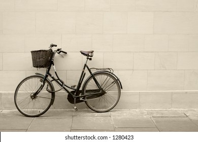 Classic Bycicle Against A Brick Wall