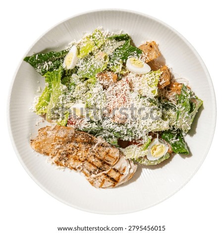 Classic caesar salad with grilled chicken parmesan lettuce and creamy dressing