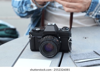 A Classic Camera Positioned on a Table Perfectly Capturing Moments with Timeless Style