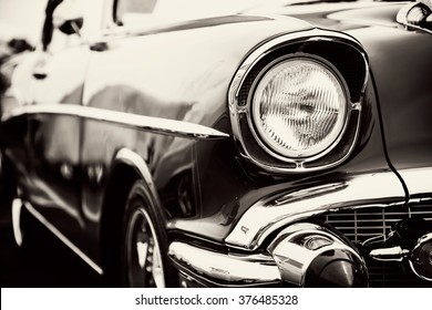 Classic car with close-up on headlights - Shutterstock ID 376485328