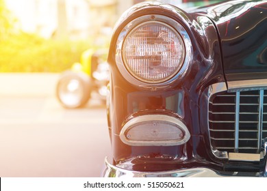 Classic Car With Close-up On Headlights Or Headlight Lamp Of Retro  Car Vintage Style.