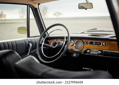 Classic Car Interior With Black Leather And Wood Trim