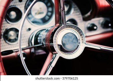 Classic car interior with close-up on steering wheel - Shutterstock ID 379706125