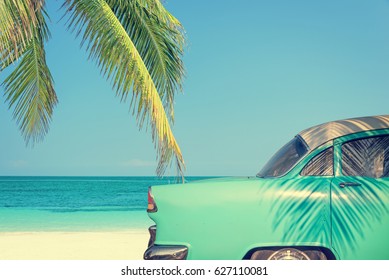 Classic Car On A Tropical Beach With Palm Tree