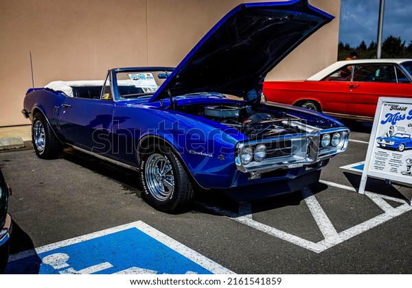 A classic\
car show with muscle cars and old school vehicles on display in\
Olympia Washington on march 14\
2022.