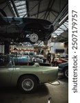 Classic cars being restored in a vintage vehicle garage workshop