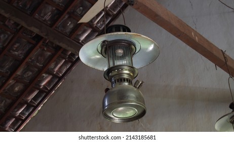 Classic Chandelier, Kerosene Fuel. Soil Tile Ceiling As Background. A Traditional House Concept In Java.