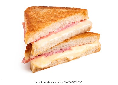 Classic cheese and ham toasted sandwich cut in half isolated on white.