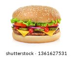 Classic cheeseburger with beef patty, pickles, cheese, tomato, onion, lettuce and ketchup mustard isolated on white background.