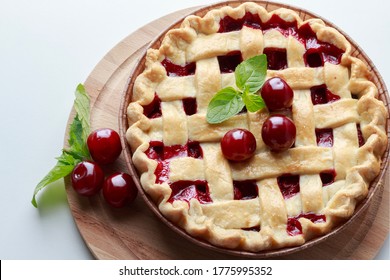 classic cherry pie on a white table