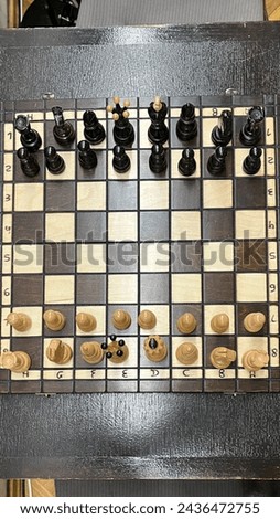 A classic chessboard set up with chess pieces ready for a strategic game, showcasing the timeless appeal of this intellectual pastime..