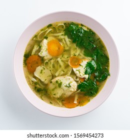 Classic Chicken Noodle Soup With Carrot And Parsley Isolated On White