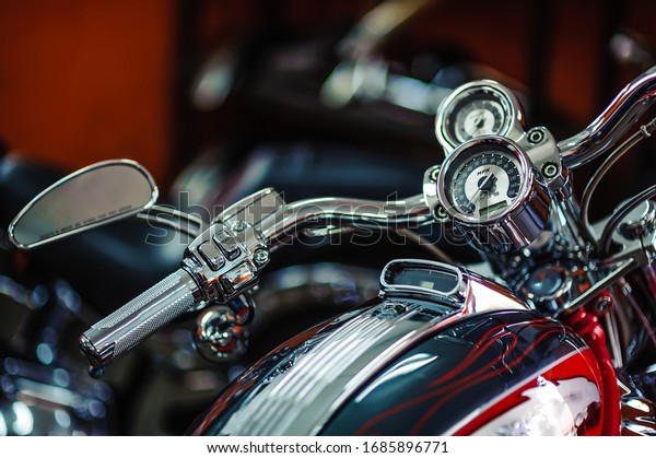 Classic chrome . Motorcycle\
handle. The gas lever on the chopper. Speed dialing. Details of the\
motorcycle close-up. Motorcycle steering wheel. Selective\
Focus