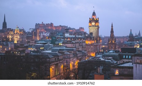 Classic cityscape view of Edinburgh old town skyline, Princes Street, Balmoral Clock Tower and Edinburgh Castle from Calton Hill at dusk in the capital city of Scotland.