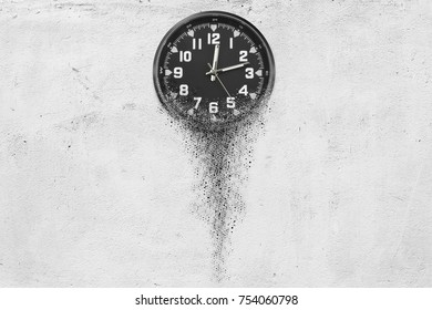 Classic clock on white concrete background disintegrate in a small parts and flowing away. Time flying concept