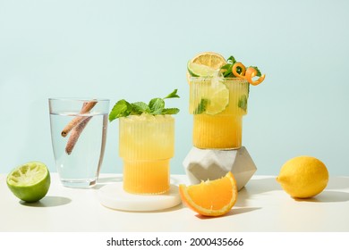 Classic cocktails, lemonade, mai tai, mojito with lime on modern still life with podium on white background. Freshness beverage for festive party. Summer holiday mocktail.