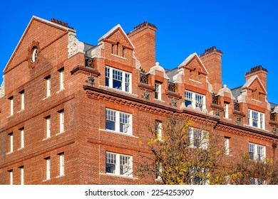 An classic colonial multistory red brick apartment strict geometric shape building with living quarters in the attic and forged balconies in the Cambridge city limit in Massachusetts in New England - Shutterstock ID 2254253907