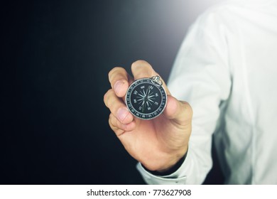 Classic compass Navigation in hand - Shutterstock ID 773627908