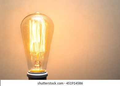 A Classic Edison Light Bulb On White Background With Space For Text