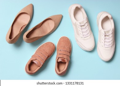 Classic hard-heeled shoes, sneakers and shoes for children on a colored background top view. Footwear for children and adults.
