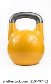 Classic heavy cast iron kettlebell, painted yellow against a white studio background.