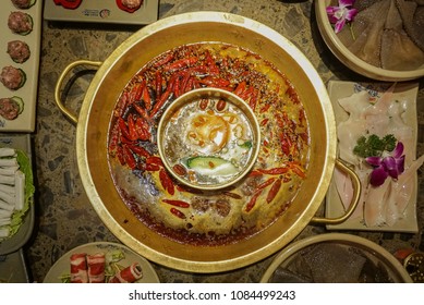 A Classic “mala” Hotpot. The Dish Consist Of A Spicy Broth In Which You Put Raw Meat And Vegetables To Cook Them Before Eating. Picture Taken In Chengdu, China