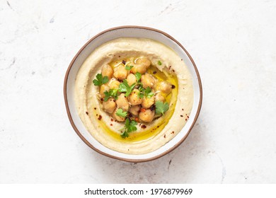 Classic hummus with parsley on a plate . Traditional hummus salad	
