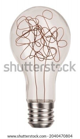 Classic incandescent light bulb with chaotic wire isolated on white background. Mind concept with symbol of complicated thinking and idea photo