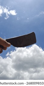 A classic iron machete placed under sunlight, highlighting its traditional design, metallic texture, and cultural heritage