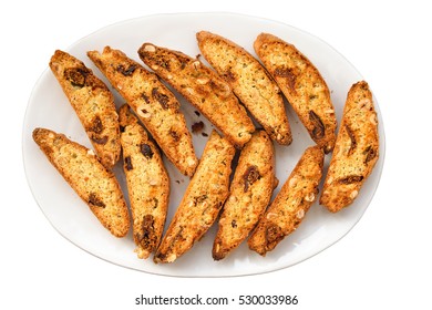 Classic Italian biscotti cookies on plate isolated a white background. Festive Christmas cookies from Tuscany.
