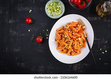 Classic Italian Pasta Penne Marinara With Mussels And Green Onions On Dark Table. Penne Pasta With Sauce Marinara. Top View, Overhead