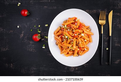 Classic Italian Pasta Penne Marinara With Mussels And Green Onions On Dark Table. Penne Pasta With Sauce Marinara. Top View, Overhead