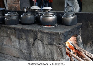 Classic kettle on a wood-burning stove - Powered by Shutterstock