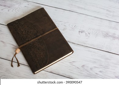 Classic Leather Bound Journal Book On A White Barn Board Floor