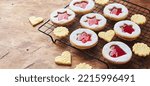 Classic Linzer Christmas Cookies with raspberry or strawberry jam. Long wide banner.