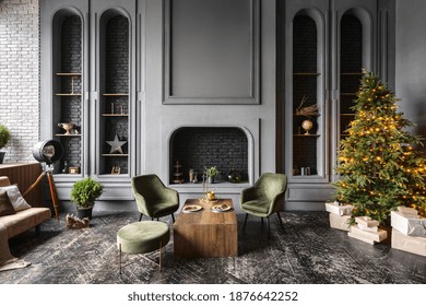 Classic Living Room With Retro Interior Design, New Year Tree, Christmas Presents, Comfort Armchairs Near Wooden Table, Decorative Fireplace And Home Decor In Grey Loft Apartment