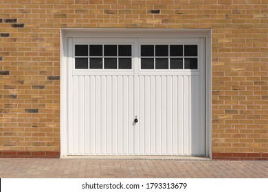 Classic Look, White Side Hinged Garage Doors, On A New Build Home.  UK