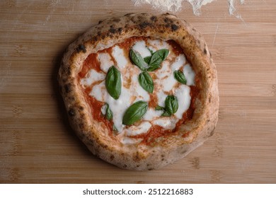 A classic margherita pizza with a golden, charred crust, topped with melted mozzarella, fresh tomato sauce, and basil leaves, presented on a wooden board dusted with flour. - Powered by Shutterstock